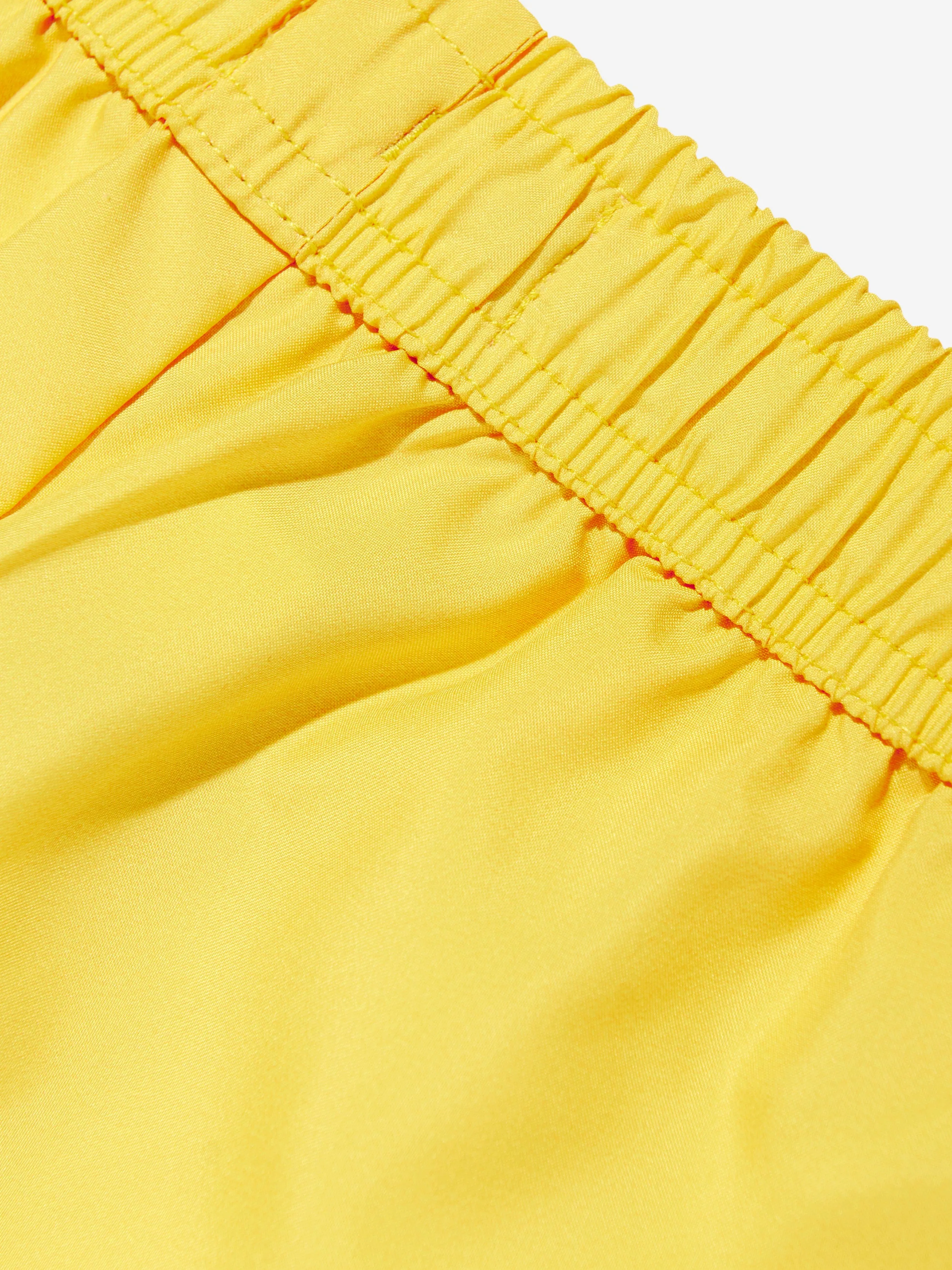 Short de bain Teddy pour garçons en jaune avec planche à voile