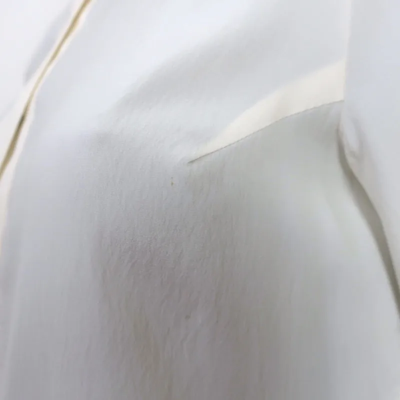 Brunello Cucinelli Blouse à encolure contrastée en soie stretch ivoire Taille L