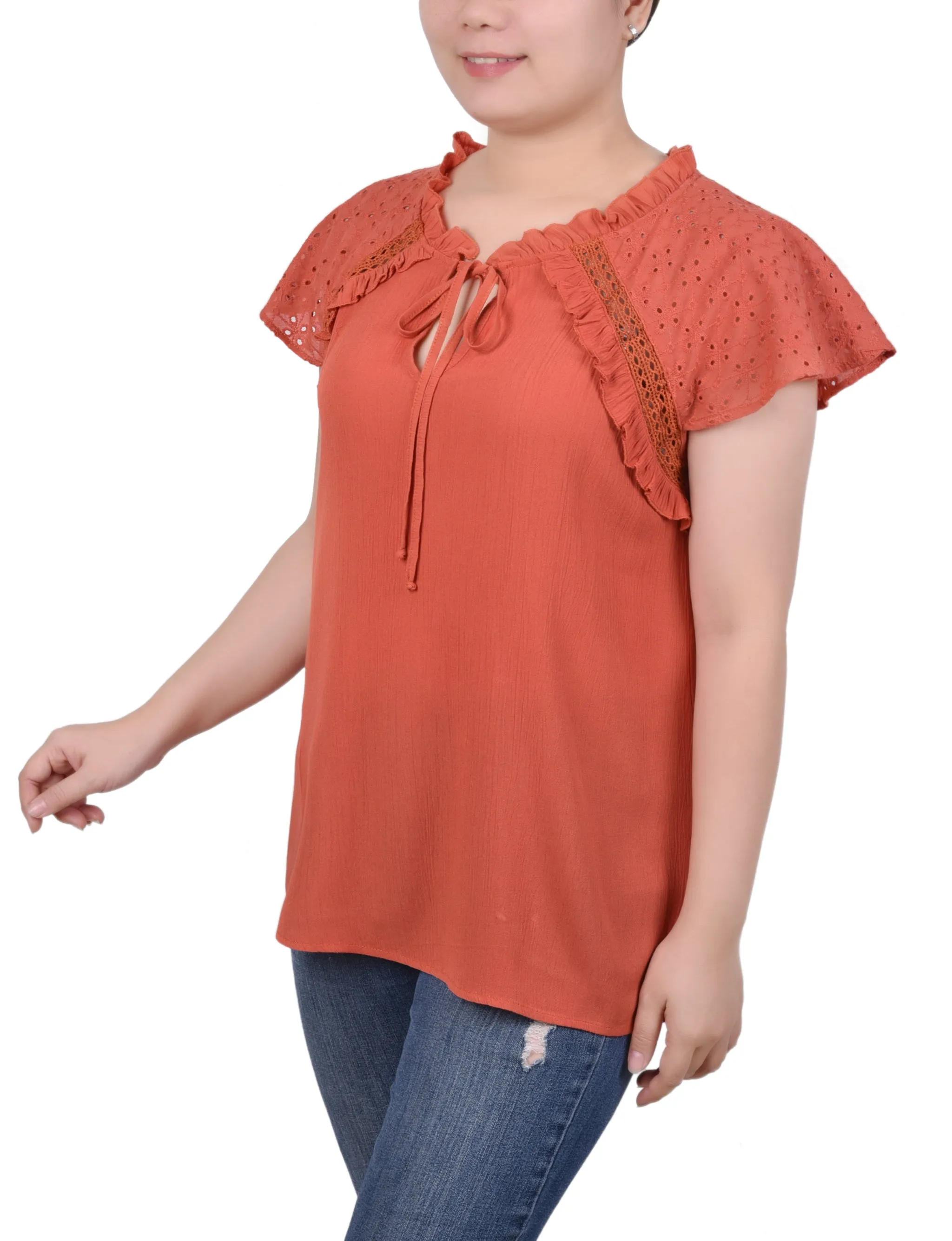 Blouse à manches œillet
