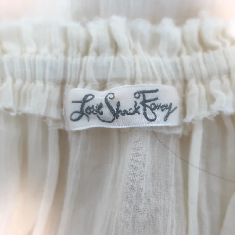 LoveShackFancy Haut à empiècement brodé avec franges et épaule dénudée en gaze écru Taille 3