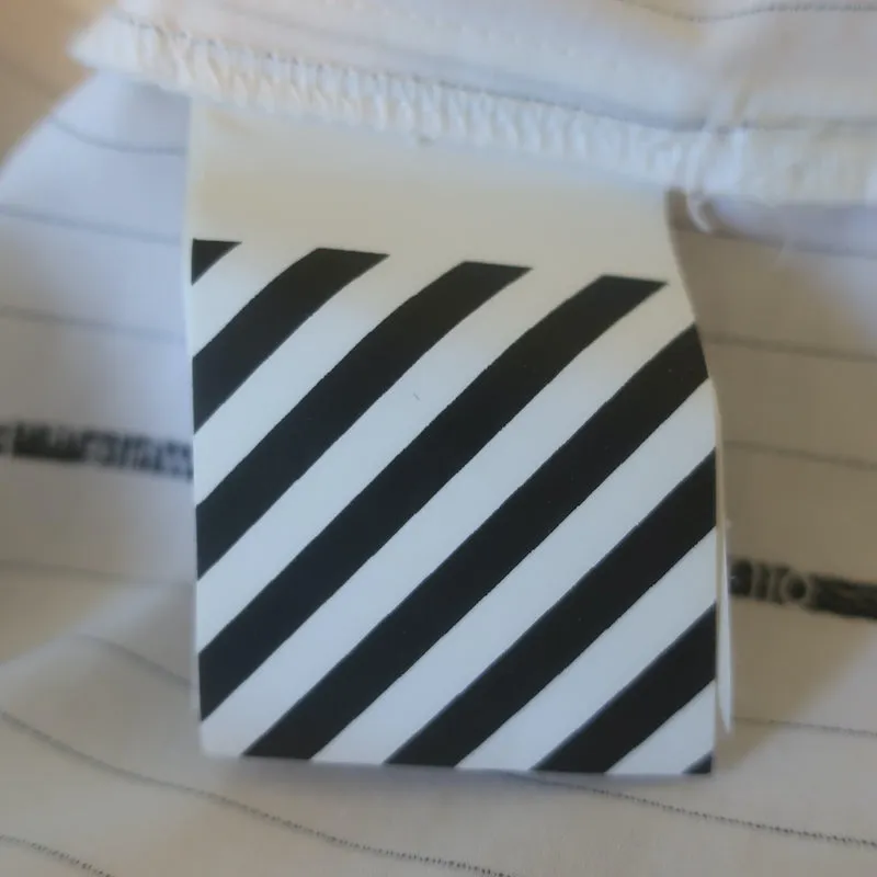 Off-White c/o Virgil Abloh Chemise à nœud devant en popeline rayée blanche Taille 40